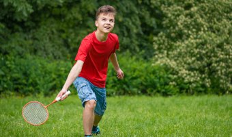 Young Teen Boy Playing Badmint