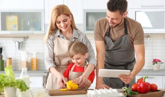 Family Cooking In Kitchen